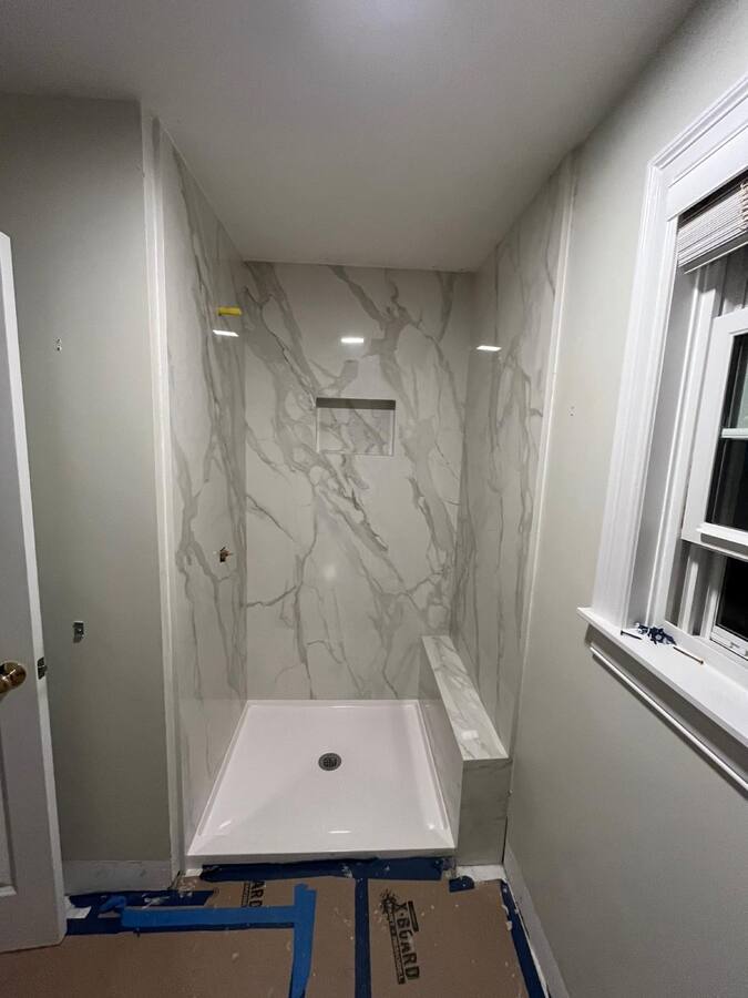 Large-format calacatta walk-in shower