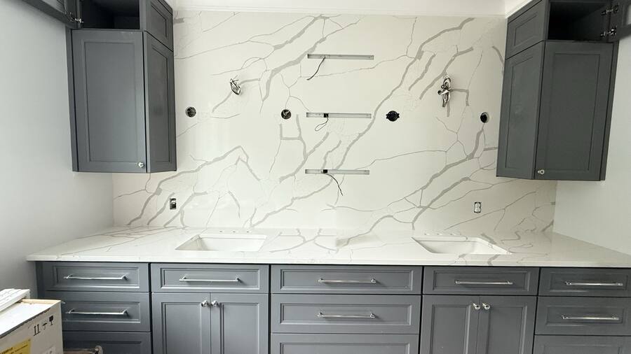 Full-height quartz slab backsplash