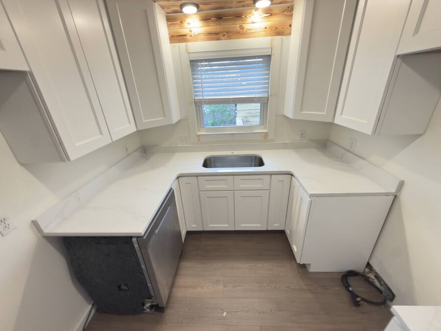 Matching slab backsplash, U-shaped kitchen