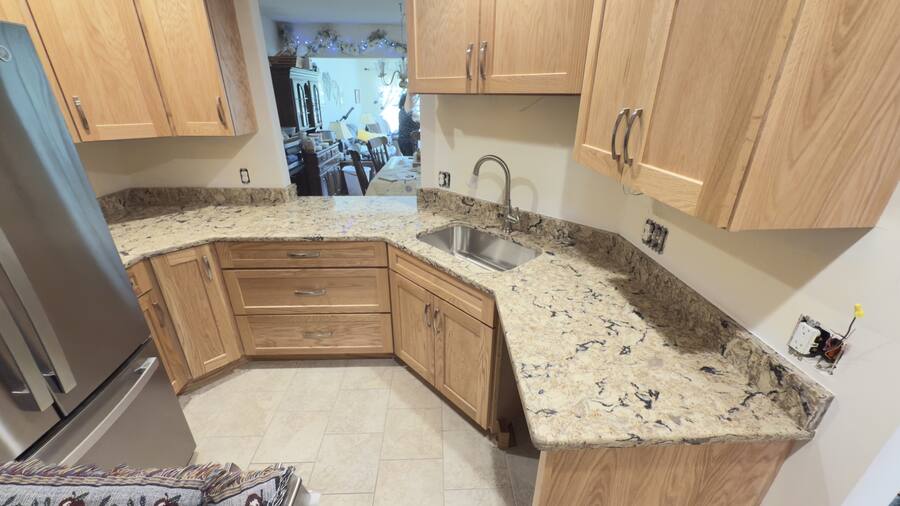 New quartz wrap on an L-shaped kitchen