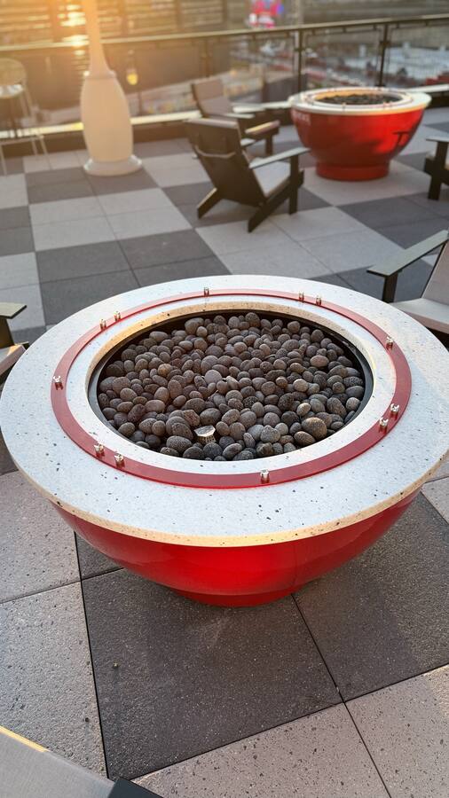 Custom fire pit on checkerboard rooftop pavers