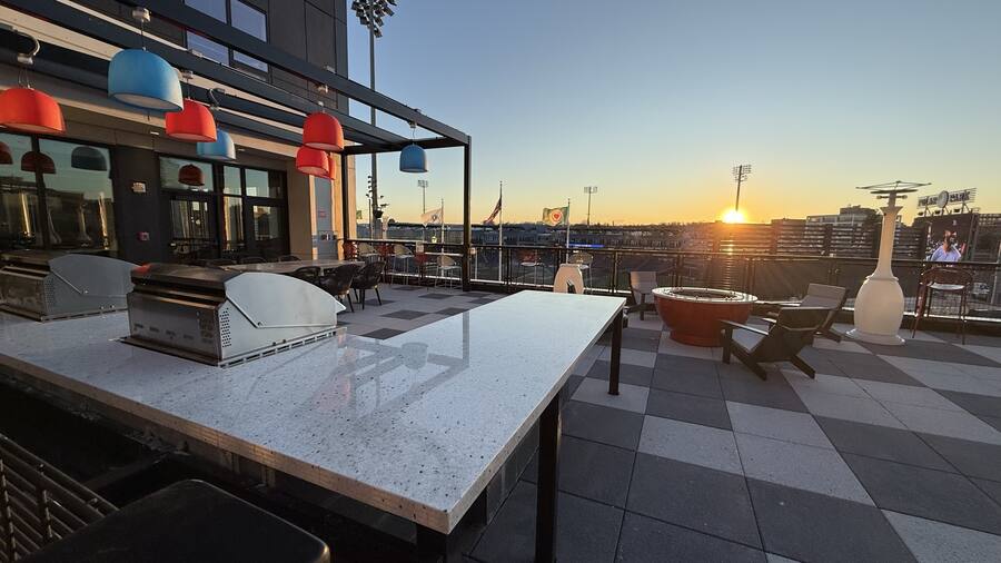 Rooftop amenity terrace — terrazzo counters
