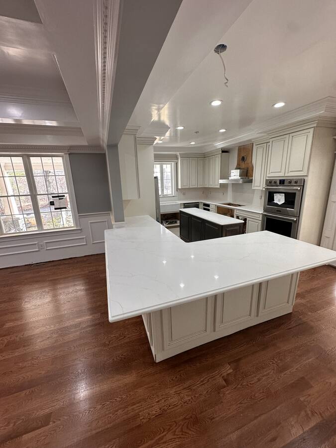 White kitchen over refinished red-oak floors