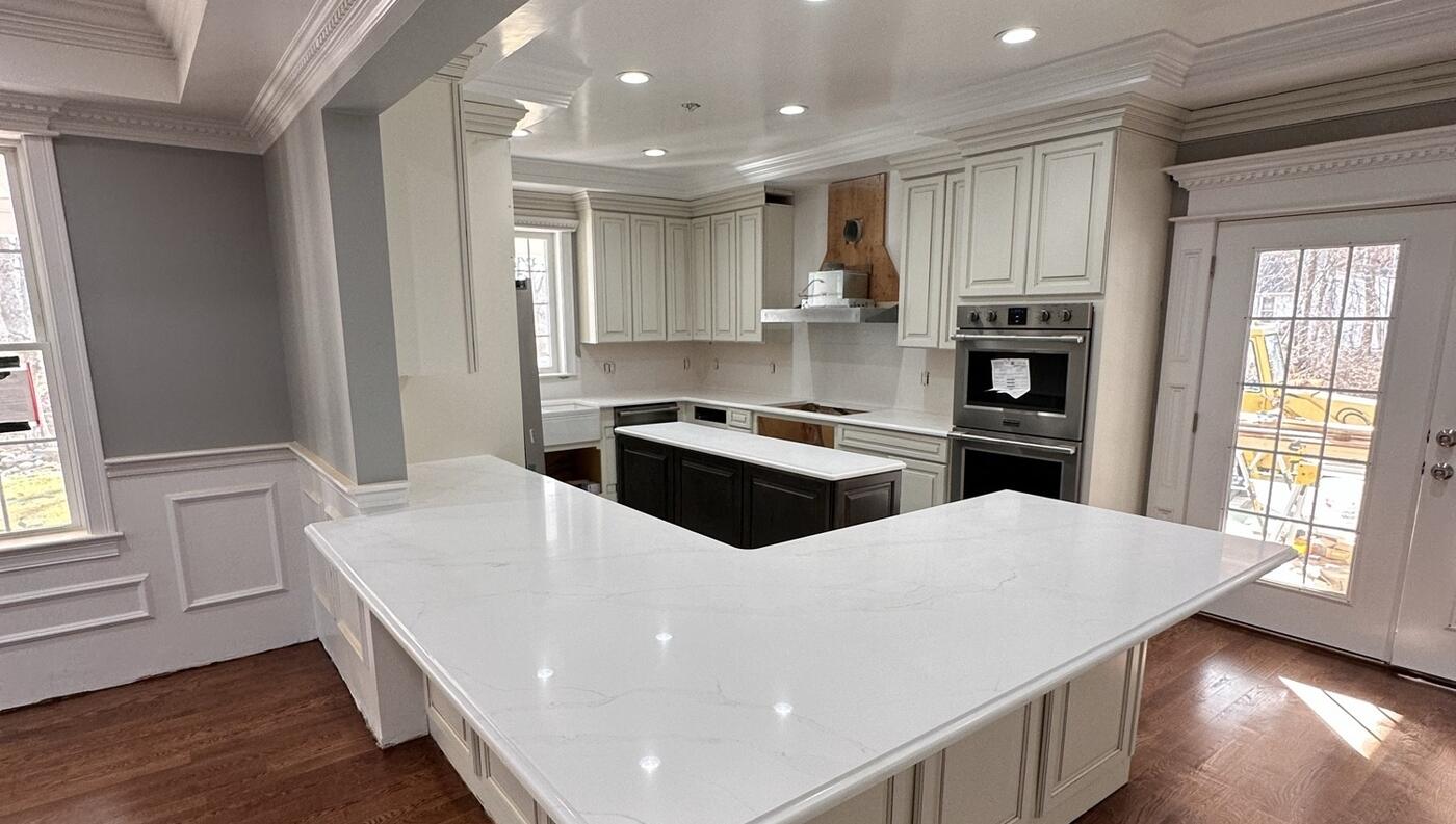 White kitchen remodel — quartz countertops and island