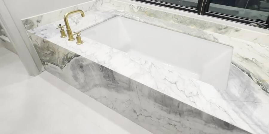Marble bath walkthrough — book-matched tub & shower